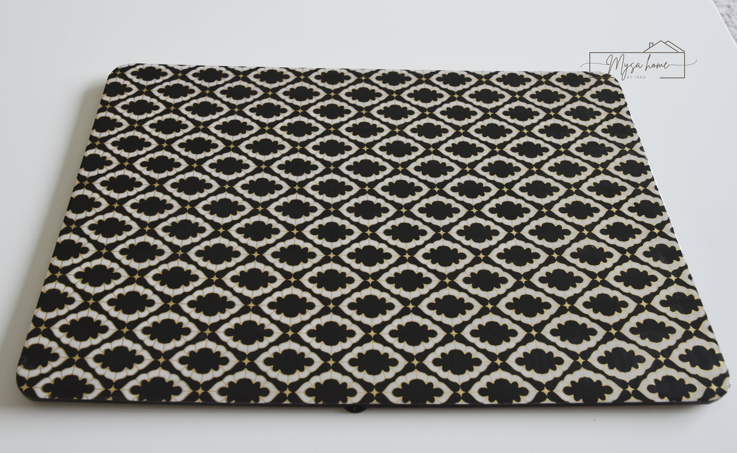 Noir black and white MDF waterproof wipe clean table mat on dining table