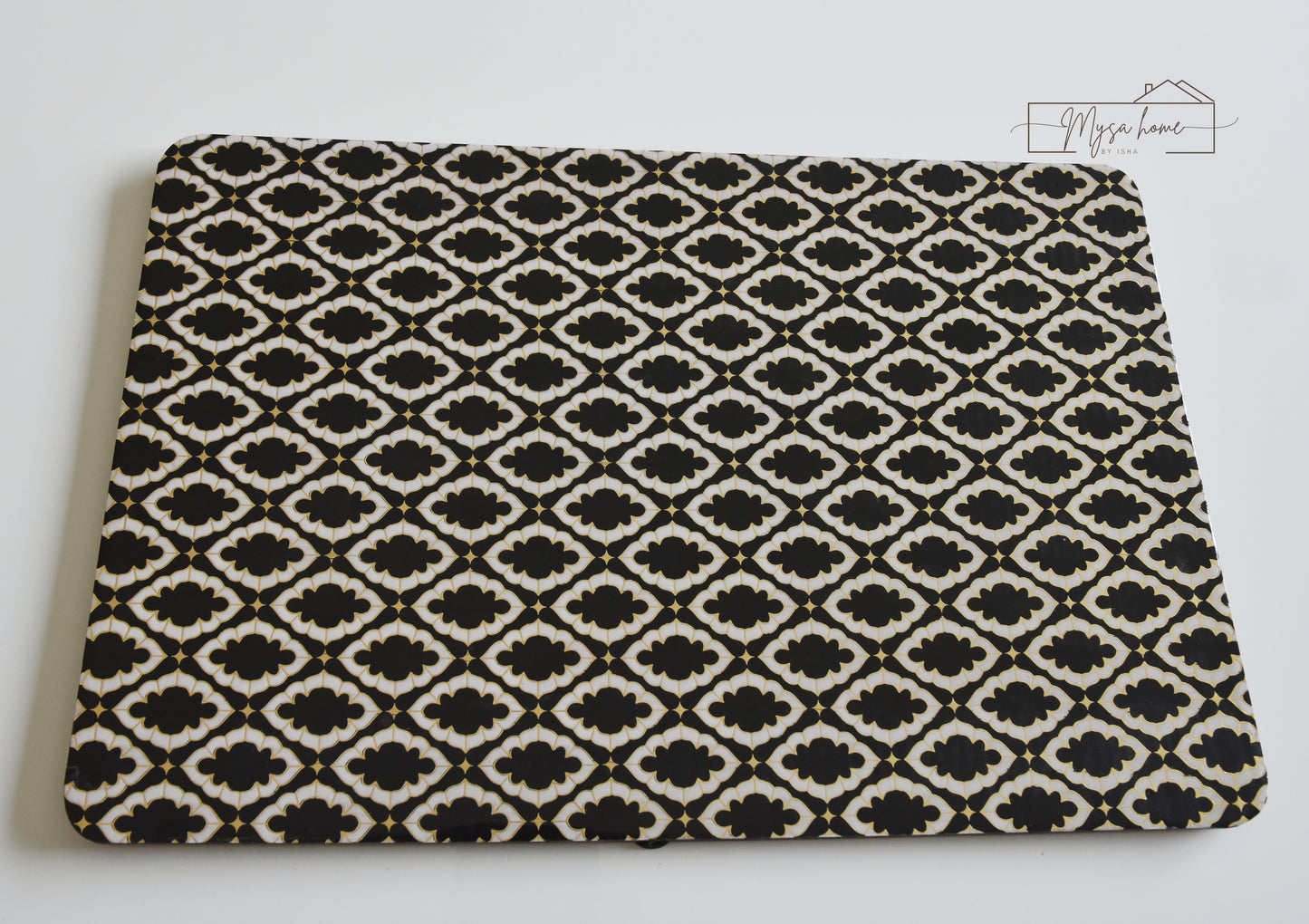 Noir black and white MDF waterproof wipe clean table mat on dining table
