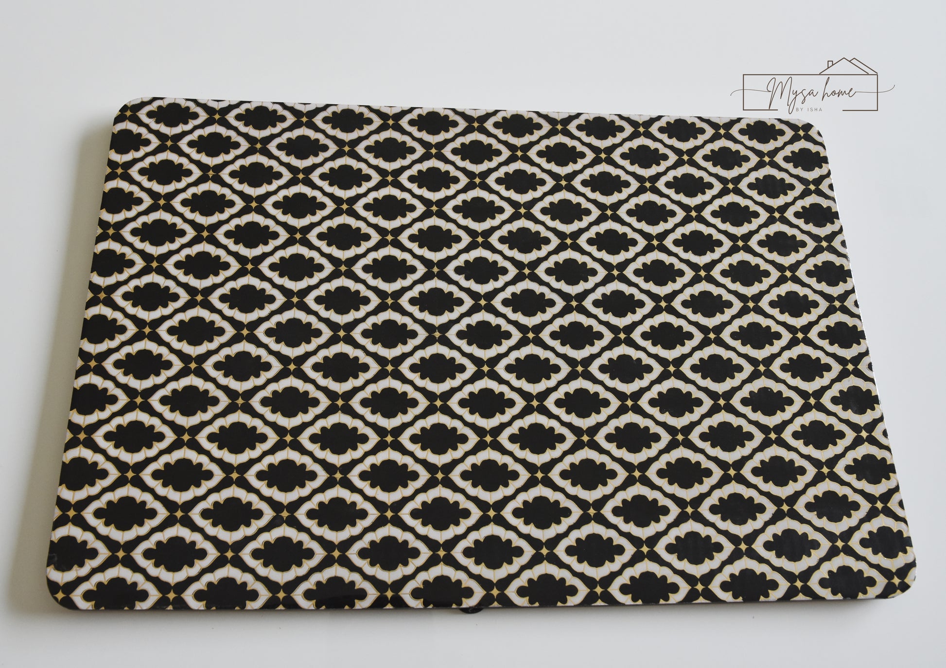 Noir black and white MDF waterproof wipe clean table mat on dining table
