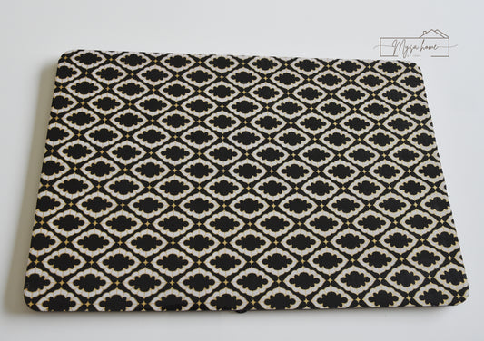 Noir black and white MDF waterproof wipe clean table mat on dining table
